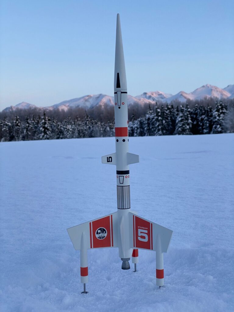 Starship Vega on snowy field.